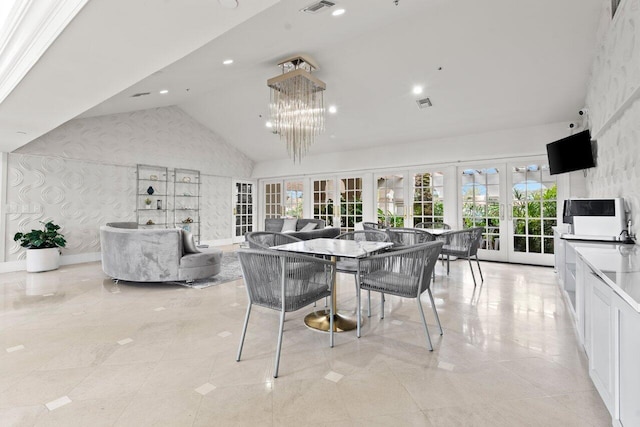 dining area with high vaulted ceiling, french doors, visible vents, and wallpapered walls