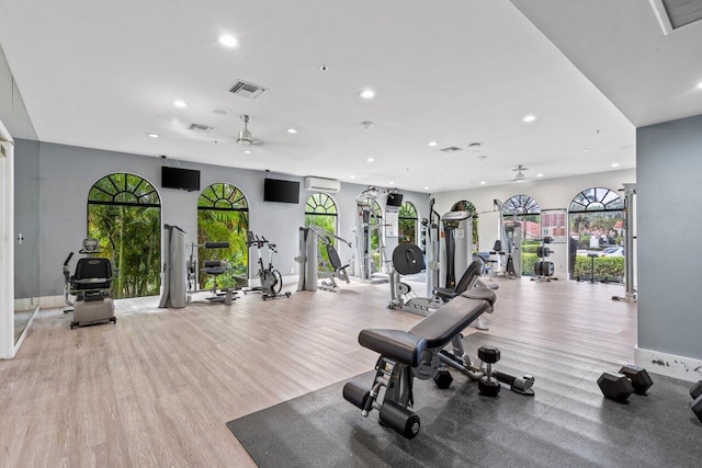 exercise room featuring light wood-type flooring, visible vents, and recessed lighting