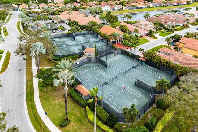 drone / aerial view with a water view and a residential view