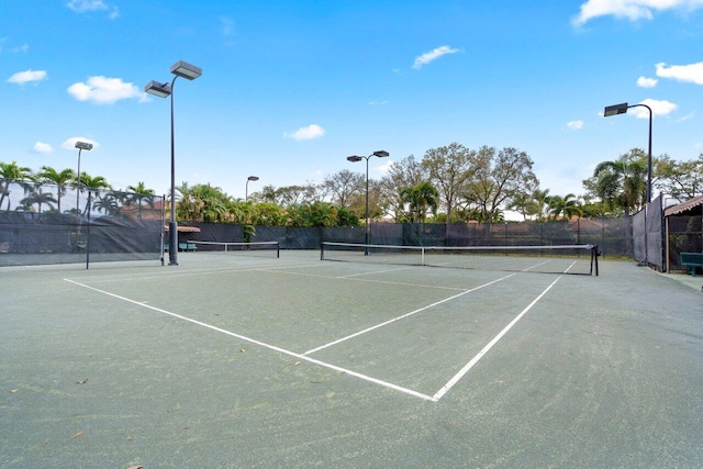 view of sport court with fence