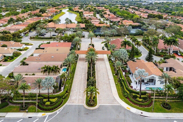 bird's eye view with a water view and a residential view