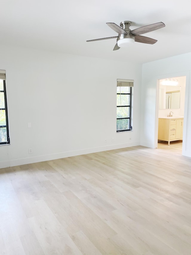 3345 Pine Hill Trl, Palm Beach Gardens, FL 33418 - unfurnished room featuring light wood-type flooring, a ceiling fan, and baseboards