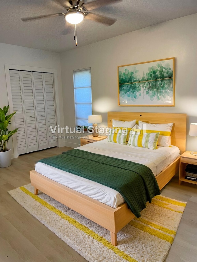 3345 Pine Hill Trl, Palm Beach Gardens, FL 33418 - bedroom featuring wood finished floors, a closet, and ceiling fan