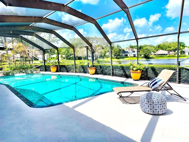 3345 Pine Hill Trl, Palm Beach Gardens, FL 33418 - swimming pool with a patio area, a lanai, and a water view