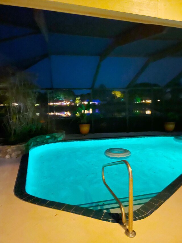 3345 Pine Hill Trl, Palm Beach Gardens, FL 33418 - swimming pool with a lanai