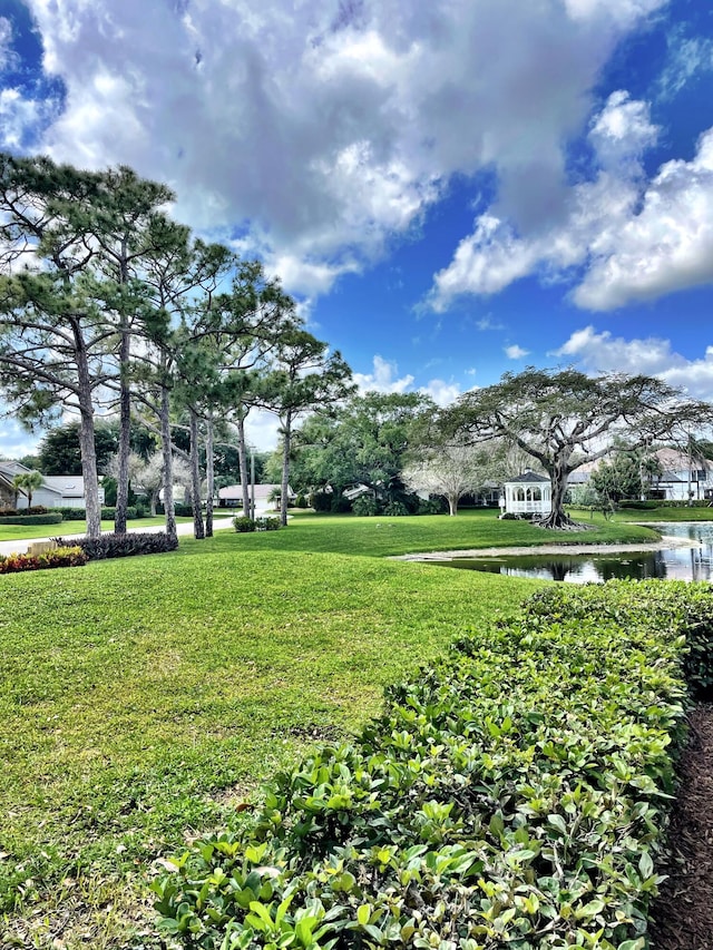 3345 Pine Hill Trl, Palm Beach Gardens, FL 33418 - view of home's community with a water view and a lawn