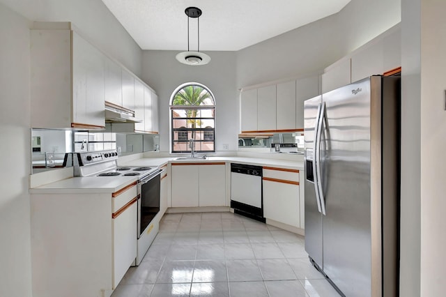 kitchen featuring white appliances, under cabinet range hood, white cabinetry, and light countertops