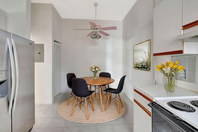 dining space with light tile patterned floors, electric panel, and a ceiling fan