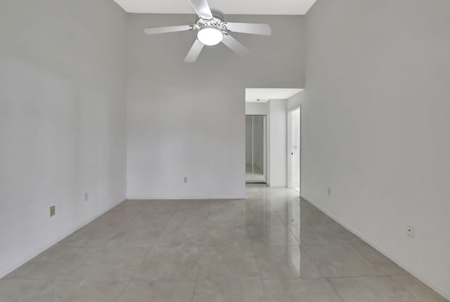 unfurnished room featuring ceiling fan and light tile patterned flooring