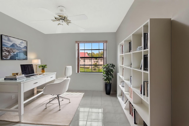 home office with ceiling fan and light tile patterned floors