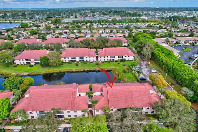 aerial view featuring a water view and a residential view