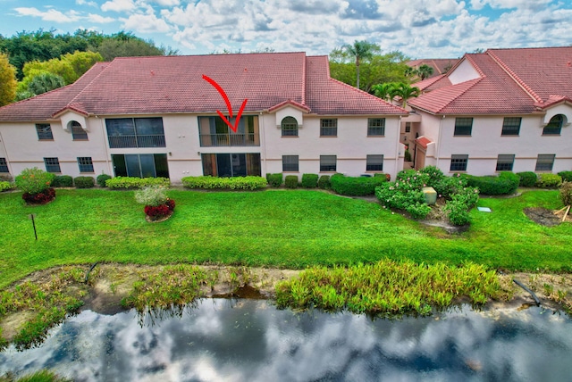 drone / aerial view with a water view