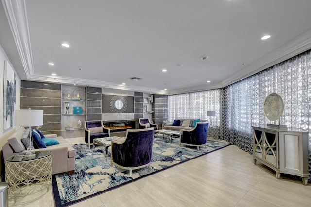 living room featuring recessed lighting, visible vents, ornamental molding, and a tile fireplace