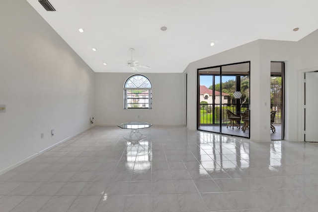 spare room featuring recessed lighting, visible vents, a ceiling fan, vaulted ceiling, and baseboards