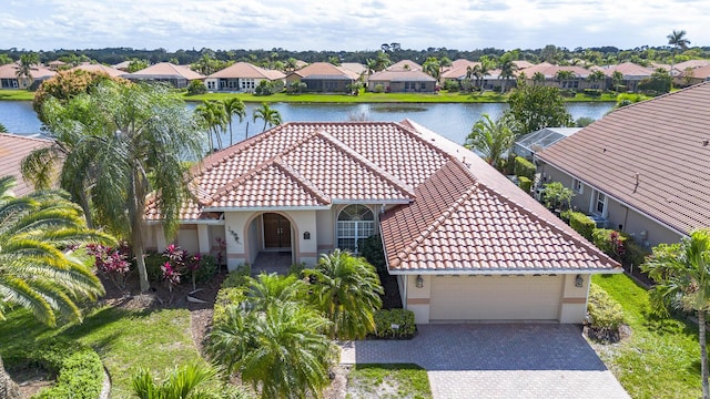 drone / aerial view with a water view and a residential view