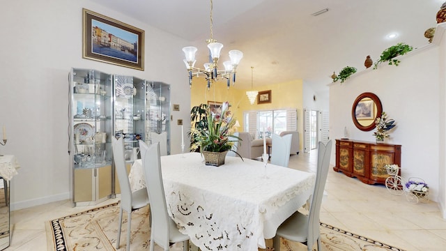 dining room with light tile patterned floors, baseboards, visible vents, and an inviting chandelier
