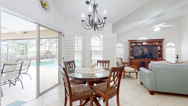 dining area featuring a sunroom, ceiling fan with notable chandelier, vaulted ceiling, and light tile patterned flooring