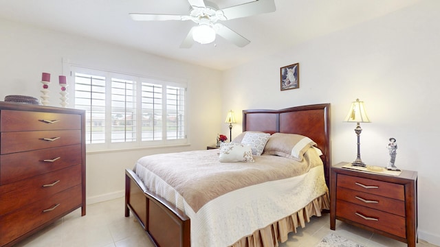 bedroom featuring ceiling fan, baseboards, and light tile patterned floors