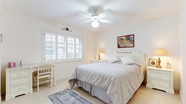 bedroom featuring ceiling fan, built in desk, baseboards, and light tile patterned floors