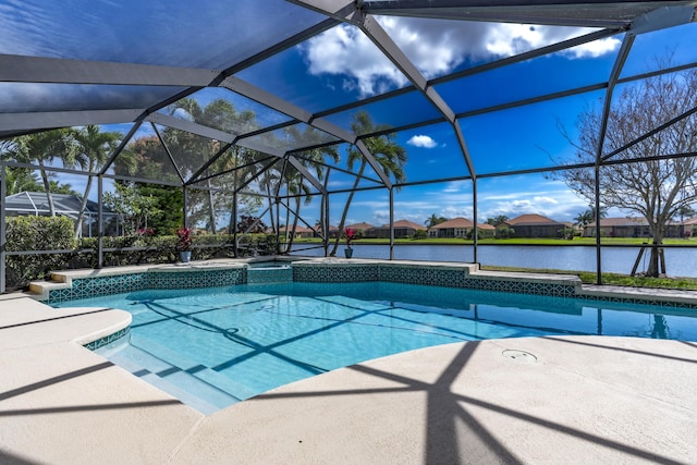 view of swimming pool featuring a patio, a water view, a lanai, and a pool with connected hot tub