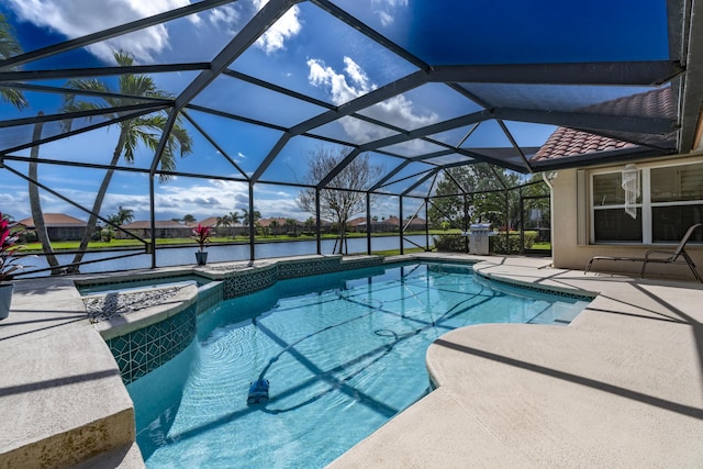 view of swimming pool featuring a pool with connected hot tub, glass enclosure, a water view, and a patio