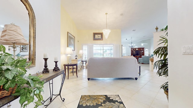 living area with a chandelier and light tile patterned floors