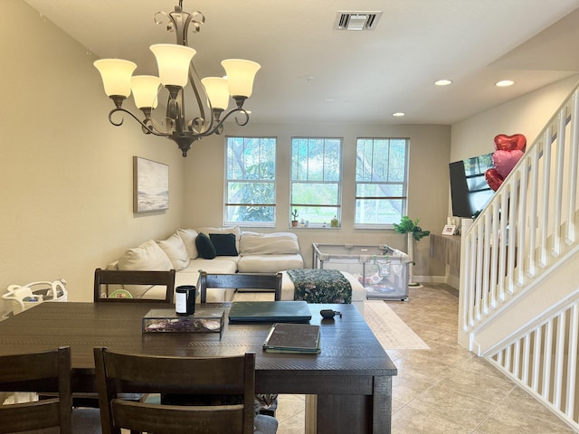 living room featuring a notable chandelier, recessed lighting, visible vents, stairway, and baseboards