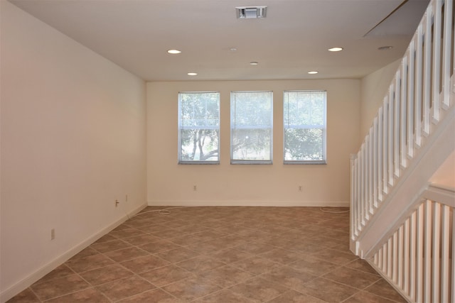 unfurnished room featuring recessed lighting, baseboards, visible vents, stairs, and light tile patterned flooring