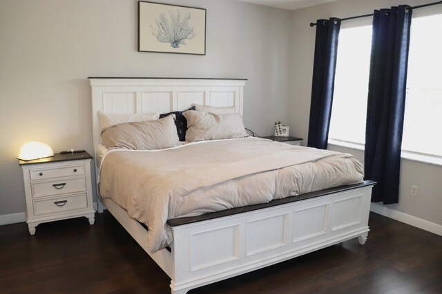 unfurnished room featuring dark wood-style floors, a textured ceiling, a ceiling fan, and baseboards