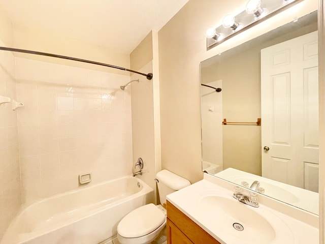 bathroom featuring toilet, tub / shower combination, and vanity