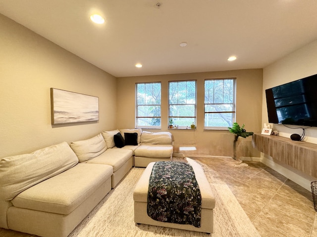 living area featuring light tile patterned floors and recessed lighting