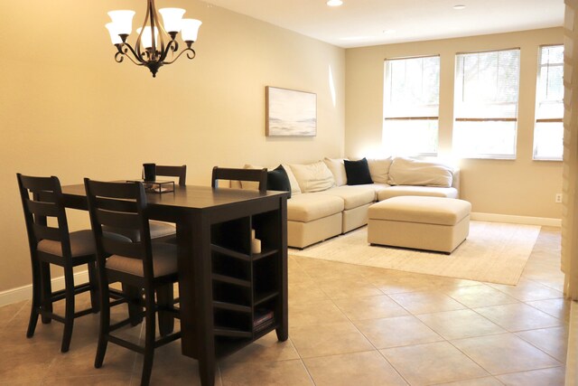 kitchen featuring dark countertops, brown cabinets, stainless steel appliances, a sink, and recessed lighting