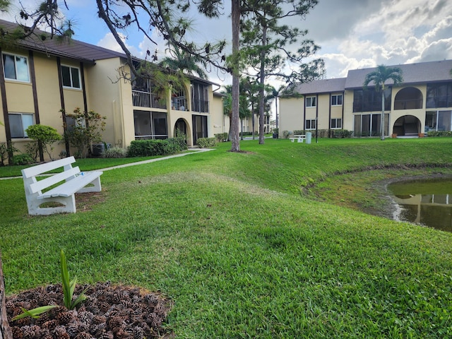 view of property's community with a yard