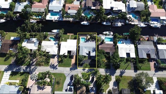 drone / aerial view with a residential view and a water view