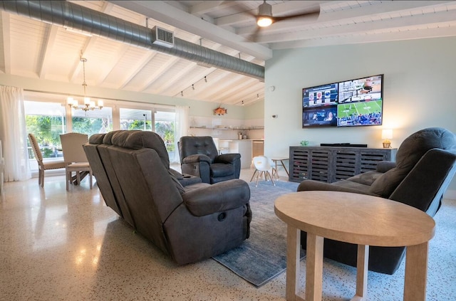 living area with visible vents, ceiling fan with notable chandelier, light speckled floor, and lofted ceiling with beams