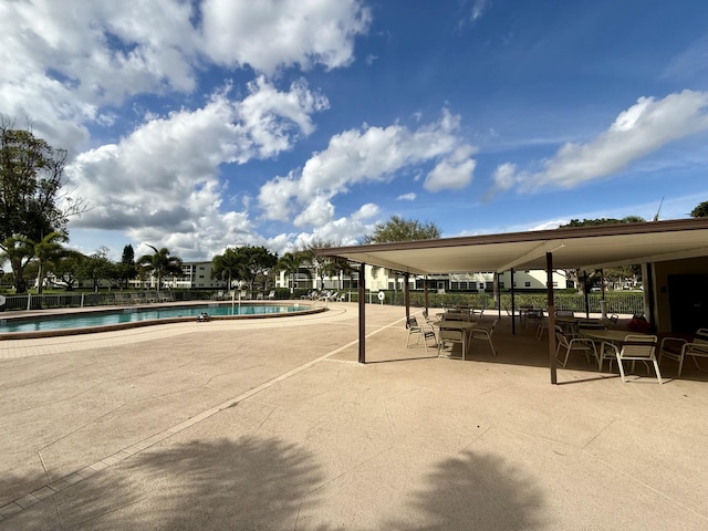 view of property's community with a patio and a swimming pool