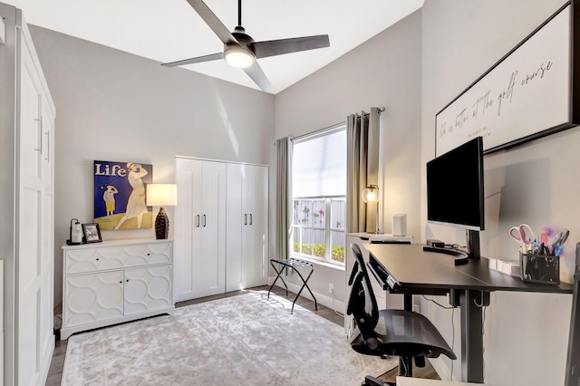 office featuring a ceiling fan and baseboards