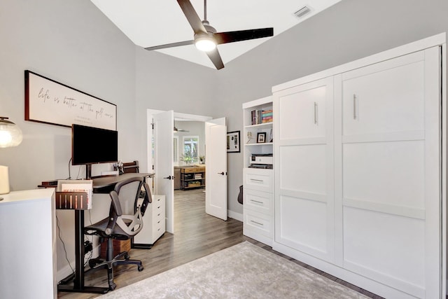 office with ceiling fan, light wood-type flooring, and visible vents