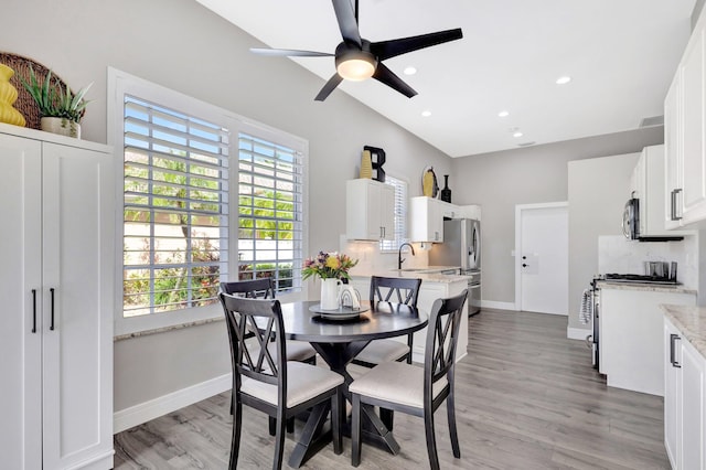 dining area with ceiling fan, recessed lighting, light wood-type flooring, and baseboards