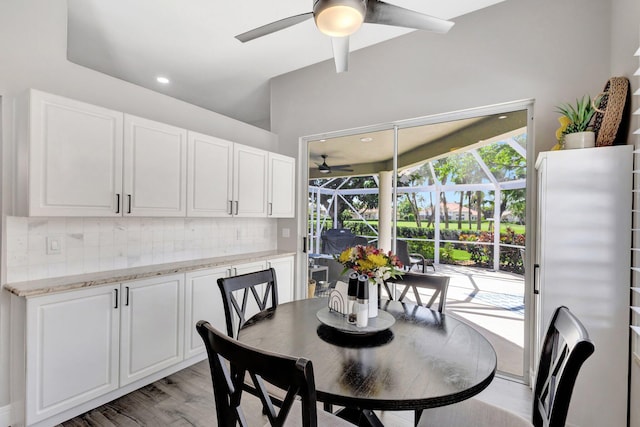 dining area with recessed lighting, light wood-type flooring, a sunroom, and a ceiling fan