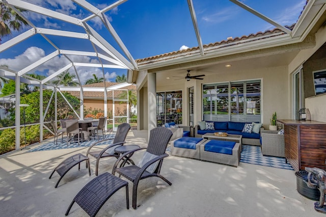 view of patio / terrace with a lanai, an outdoor living space, and outdoor dining space