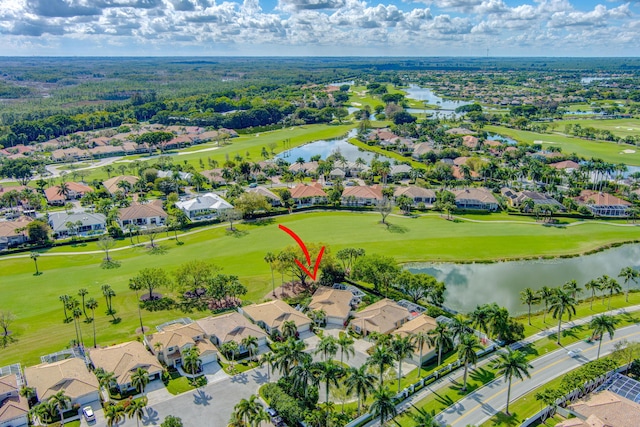 birds eye view of property featuring a residential view, a water view, and golf course view