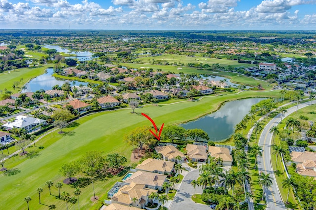 bird's eye view featuring a water view, a residential view, and golf course view