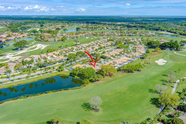 bird's eye view with view of golf course and a water view