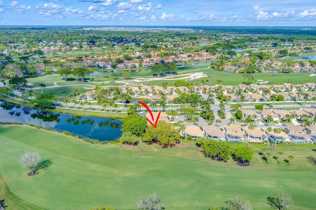 birds eye view of property featuring golf course view, a water view, and a residential view