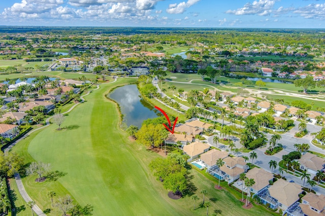 bird's eye view featuring golf course view, a water view, and a residential view