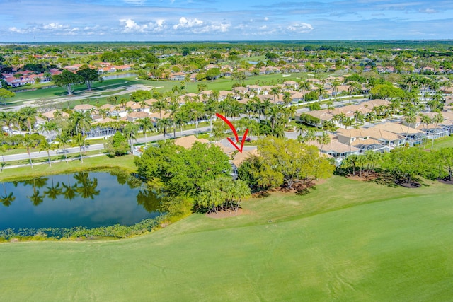 birds eye view of property featuring golf course view, a water view, and a residential view