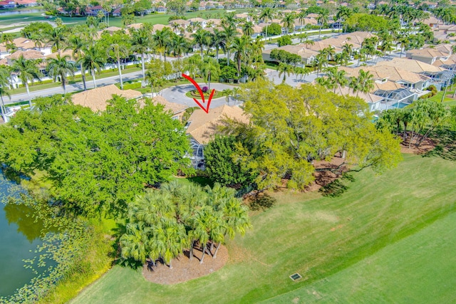 drone / aerial view featuring a water view and a residential view