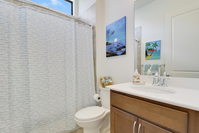 bathroom featuring toilet, a shower with curtain, and vanity