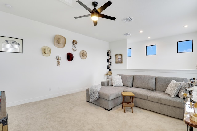 living room featuring recessed lighting, light colored carpet, visible vents, ceiling fan, and baseboards